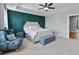 Stylish bedroom featuring a teal accent wall, modern furnishings, and soft, natural light at 539 Cooper Village Ln, Mount Pleasant, SC 29464