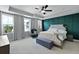 Serene bedroom with accent wall, tray ceilings, plush carpet and stylish furniture at 539 Cooper Village Ln, Mount Pleasant, SC 29464