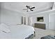 Bright bedroom with a tray ceiling, ceiling fan, and a large window for natural light at 539 Cooper Village Ln, Mount Pleasant, SC 29464