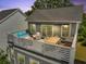 Charming deck area with seating, dining table, and retractable awning, ideal for relaxing and entertaining at 539 Cooper Village Ln, Mount Pleasant, SC 29464