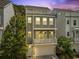 Exterior of a three-story townhome with a garage and a top floor deck perfect for entertaining at 539 Cooper Village Ln, Mount Pleasant, SC 29464