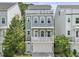 Charming three-story home featuring a rooftop deck, a two-car garage, and inviting curb appeal at 539 Cooper Village Ln, Mount Pleasant, SC 29464