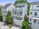 Three-story home featuring a deck, balconies, landscaping, and a paved driveway for added curb appeal at 539 Cooper Village Ln, Mount Pleasant, SC 29464