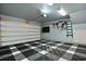 Spacious garage with finished flooring, wall mount storage, and garage door opener at 539 Cooper Village Ln, Mount Pleasant, SC 29464