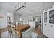 Open kitchen featuring an island with seating, dining area, and stainless steel refrigerator at 539 Cooper Village Ln, Mount Pleasant, SC 29464