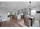 Open kitchen with an island and bar stool seating connects to dining and living areas at 539 Cooper Village Ln, Mount Pleasant, SC 29464