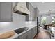 Modern kitchen featuring gray cabinets, a white range hood, and stainless steel appliances at 539 Cooper Village Ln, Mount Pleasant, SC 29464