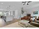 Open-concept layout showcases living room that flows into a modern kitchen with an eat-in kitchen island at 539 Cooper Village Ln, Mount Pleasant, SC 29464
