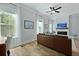 Cozy living room with a modern fireplace, a large window with sheer curtains, and wood flooring at 539 Cooper Village Ln, Mount Pleasant, SC 29464