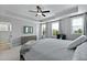 Calm bedroom with tray ceilings, stylish furniture and view of the outdoors at 539 Cooper Village Ln, Mount Pleasant, SC 29464