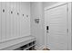 Convenient mudroom with storage bench, hooks, and easy access to the front door at 539 Cooper Village Ln, Mount Pleasant, SC 29464