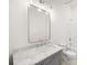 Bathroom featuring white marble counter, modern mirror and fixtures at 55 Maple St, Charleston, SC 29403