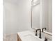 Elegant bathroom showcasing a vanity with modern faucet and a stylish mirror at 55 Maple St, Charleston, SC 29403