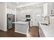 Modern kitchen with white cabinets, stainless steel appliances, and a center island at 55 Maple St, Charleston, SC 29403