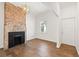 Living room showcases brick fireplace and hardwood floors at 55 Maple St, Charleston, SC 29403