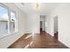 Bright living room featuring hardwood floors and a modern light fixture at 55 Maple St, Charleston, SC 29403