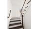 White and dark-stained staircase with wood banister at 55 Maple St, Charleston, SC 29403