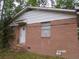 Brick house with a side door. The house needs some TLC at 604 King St, Walterboro, SC 29488