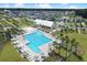 Aerial view of the community showcasing pool, clubhouse, homes, and landscaping, offering a vibrant lifestyle at 619 Trio Ln, Summerville, SC 29486