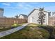 Landscaped backyard with a stone path and wood fence, ideal for outdoor entertaining at 619 Trio Ln, Summerville, SC 29486
