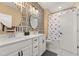 This bathroom features patterned walls, a double sink, and a shower with a Mickey Mouse shower curtain at 619 Trio Ln, Summerville, SC 29486