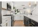 Modern kitchen featuring stainless appliances, subway tile backsplash, and stylish gold hardware at 619 Trio Ln, Summerville, SC 29486