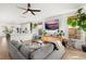 Cozy living room featuring a large sectional sofa and open view to the modern kitchen at 619 Trio Ln, Summerville, SC 29486