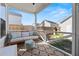 Relaxing screened patio with comfortable seating, overhead string lights, and a view of the backyard at 619 Trio Ln, Summerville, SC 29486