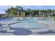 Stunning resort-style swimming pool with sunbeds and umbrellas for relaxing in the sun at 619 Trio Ln, Summerville, SC 29486