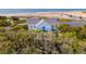 Serene property with the ocean in the background, surrounded by abundant trees and natural landscape at 67 Lost Village Trl # 4, Edisto Island, SC 29438