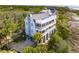 Expansive home with multi-level decks, nestled between lush greenery and beach access at 67 Lost Village Trl # 4, Edisto Island, SC 29438