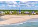 An aerial view of the beach featuring the location of the property indicated by a blue arrow at 67 Lost Village Trl # 4, Edisto Island, SC 29438