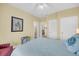Bright bedroom with a ceiling fan, and access to an ensuite bathroom at 67 Lost Village Trl # 4, Edisto Island, SC 29438