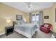 Cozy bedroom with a comfortable bed, soft lighting, and access to a scenic balcony at 67 Lost Village Trl # 4, Edisto Island, SC 29438