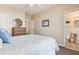 Well-appointed bedroom with neutral tones featuring a large bed and an ensuite bathroom at 67 Lost Village Trl # 4, Edisto Island, SC 29438