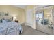 Comfortable bedroom featuring mirrored closet doors and a scenic view at 67 Lost Village Trl # 4, Edisto Island, SC 29438