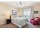 Bright bedroom featuring a ceiling fan, access to a balcony, and cozy decor at 67 Lost Village Trl # 4, Edisto Island, SC 29438