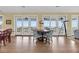 Dining area with seating for four and glass sliding doors to deck and beach views at 67 Lost Village Trl # 4, Edisto Island, SC 29438