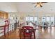 Open dining space with seating for 12 and multiple sliding glass doors to outside deck at 67 Lost Village Trl # 4, Edisto Island, SC 29438