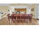 Well-lit dining room featuring seating for 12 and an open kitchen area at 67 Lost Village Trl # 4, Edisto Island, SC 29438