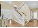 Inviting foyer with staircase, elegant console table, and a bright, airy ambiance at 67 Lost Village Trl # 4, Edisto Island, SC 29438