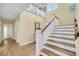 Welcoming foyer with hardwood floors, a staircase, and abundant natural light at 67 Lost Village Trl # 4, Edisto Island, SC 29438
