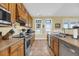 Bright kitchen with stainless steel appliances and custom oak cabinets at 67 Lost Village Trl # 4, Edisto Island, SC 29438