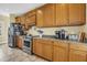 Kitchen with stainless steel appliances, breakfast bar, and oak cabinets at 67 Lost Village Trl # 4, Edisto Island, SC 29438