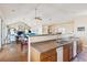 Open concept with kitchen and view to dining area and living space with vaulted ceiling at 67 Lost Village Trl # 4, Edisto Island, SC 29438