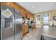 Bright kitchen featuring stainless steel appliances and custom wooden cabinets at 67 Lost Village Trl # 4, Edisto Island, SC 29438