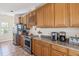 Long galley style kitchen with stainless steel appliances, and oak cabinetry at 67 Lost Village Trl # 4, Edisto Island, SC 29438