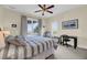 Bright main bedroom features coastal views, a comfortable bed, and a functional workspace at 67 Lost Village Trl # 4, Edisto Island, SC 29438