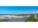 Picturesque marsh view extending to the beach and ocean on a bright day with pelicans overhead at 67 Lost Village Trl # 4, Edisto Island, SC 29438
