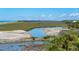 Beautiful marsh view with distant ocean and beach and pelicans flying above on a clear day at 67 Lost Village Trl # 4, Edisto Island, SC 29438